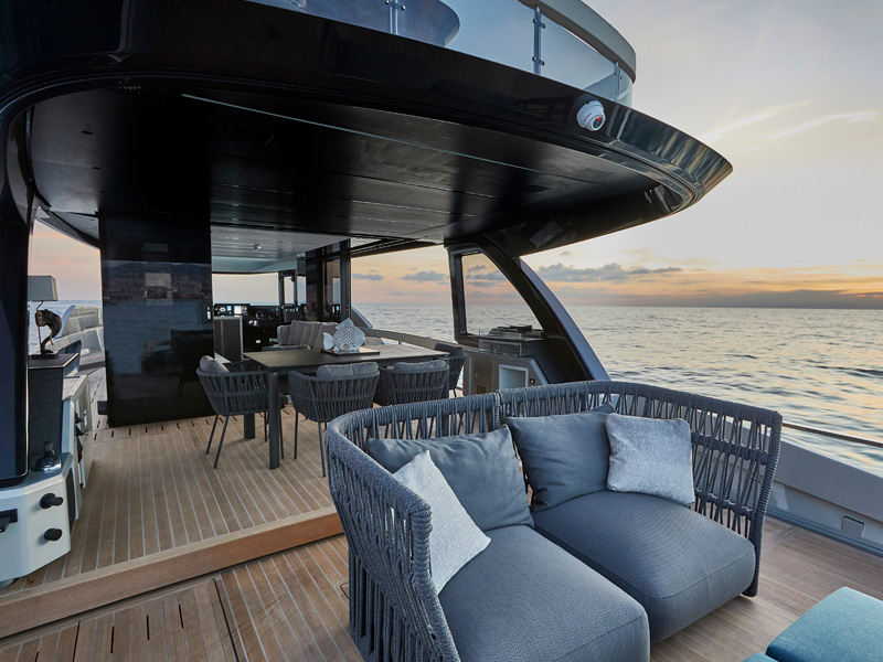 Explorer 62 Luxury Yacht Aft Cockpit with Outdoor Lounge and Dining Area Designed by Italian Yacht Designer Marco Parentela