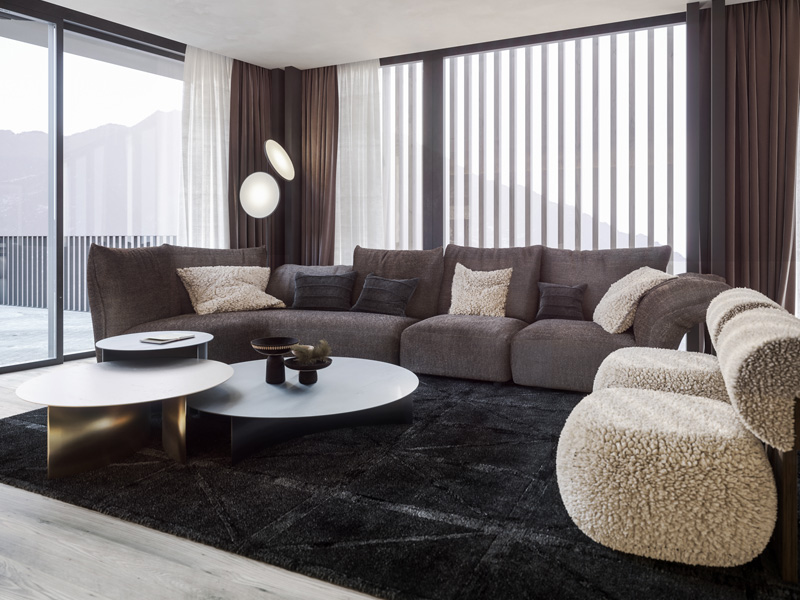 Living Room of Chesa Fortuna Apartment 1 in St. Moritz with Custom Corner Sofa and Panoramic Windows Designed by Marco Parentela