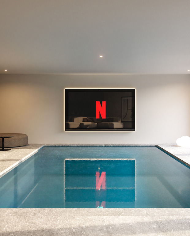 Indoor Pool with Integrated TV and Spa Lounge in a Private Villa in Muzzano, Italy Designed by Marco Parentela